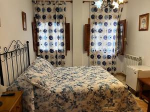 Postel nebo postele na pokoji v ubytování Hostal Moraima