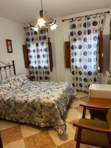 Postel nebo postele na pokoji v ubytování Hostal Moraima