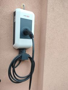 a pay phone on the side of a wall at BnB LES OISEAUX, chez Lidia, 26m2 à 44m2, 2ème étage in Vendlincourt