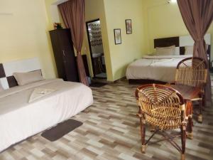 Uma cama ou camas num quarto em Jeru Homes