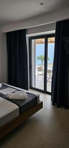 Postel nebo postele na pokoji v ubytování DG Luxury Apartments