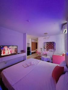 a bedroom with a large bed with a purple ceiling at Dreamy'home-Căn Hộ view biển in Ha Long