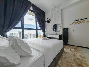 a bedroom with a large bed with a large window at Modern Elegance - Urban Suites by Ocean Luxe in Jelutong +48 photos