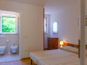 A bed or beds in a room at Residence Augusto Még 37 kép