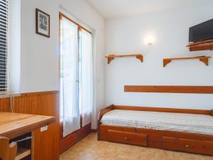 A bed or beds in a room at Residence Augusto
