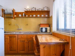 A kitchen or kitchenette at Residence Augusto