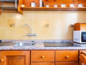 A kitchen or kitchenette at Residence Augusto