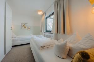 Posteľ alebo postele v izbe v ubytovaní Apartment Hotel Pfeifer