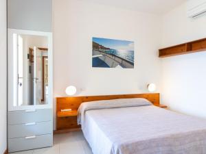 A bed or beds in a room at Residence Augusto