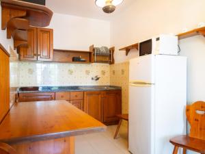 A kitchen or kitchenette at Residence Augusto