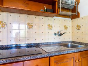 A kitchen or kitchenette at Residence Augusto
