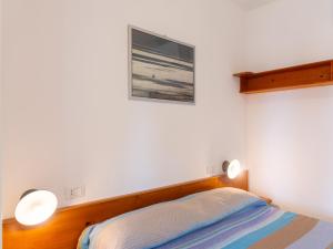 A bed or beds in a room at Residence Augusto