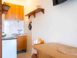 A kitchen or kitchenette at Residence Augusto