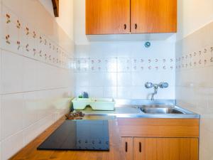 A kitchen or kitchenette at Residence Augusto