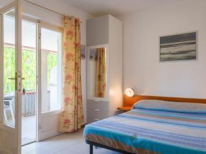 A bed or beds in a room at Residence Augusto