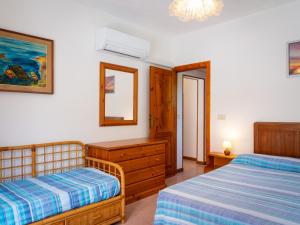 A bed or beds in a room at Residence Augusto