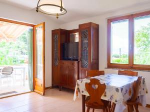 A television and/or entertainment centre at Residence Augusto