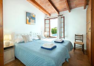 Postel nebo postele na pokoji v ubytování Owl Booking Villa Teo - Rustic Stay
