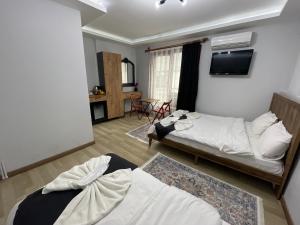 Postel nebo postele na pokoji v ubytování Le Valeria Deluxe
