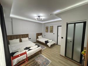 Postel nebo postele na pokoji v ubytování Le Valeria Deluxe