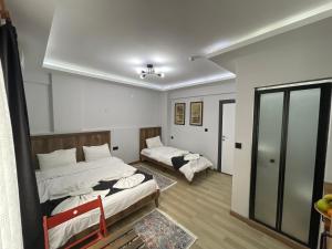 Postel nebo postele na pokoji v ubytování Le Valeria Deluxe