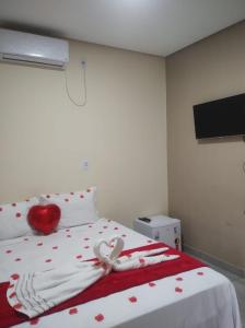 Cama ou camas em um quarto em Pousada Vista da Serra - Suzart