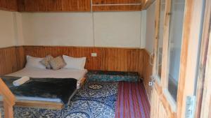 Postel nebo postele na pokoji v ubytování Rustichome