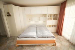 Postel nebo postele na pokoji v ubytování Ferienwohnung Seesternresidenz App.12