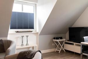 TV a/nebo společenská místnost v ubytování Ferienwohnung Sommerwind