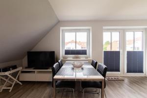 TV a/nebo společenská místnost v ubytování Ferienwohnung Sommerwind