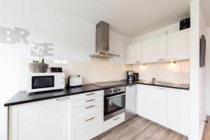 Kuchyň nebo kuchyňský kout v ubytování Ferienwohnung Sommerwind