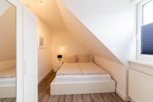 Postel nebo postele na pokoji v ubytování Ferienwohnung Sommerwind