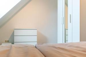 Postel nebo postele na pokoji v ubytování Ferienwohnung Sommerwind