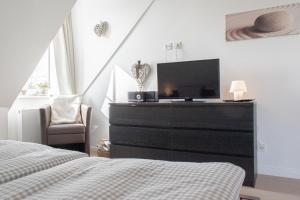 Postel nebo postele na pokoji v ubytování Ferienwohnung Strandnah