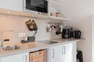 Kuchyň nebo kuchyňský kout v ubytování Ferienwohnung Strandnah