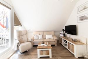 TV a/nebo společenská místnost v ubytování Ferienwohnung Ausblick