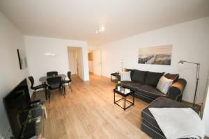 Телевизор и/или развлекательный центр в Ferienwohnung Küstentraum