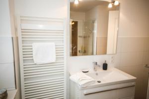 Ванная комната в Ferienwohnung Küstentraum +17 фотографий