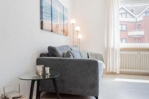 Posezení v ubytování Ferienwohnung Strandkörbchen - Scharbeutz
