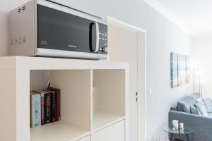 TV a/nebo společenská místnost v ubytování Ferienwohnung Strandkörbchen - Scharbeutz