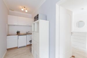 Kuchyň nebo kuchyňský kout v ubytování Ferienwohnung Strandkörbchen - Scharbeutz