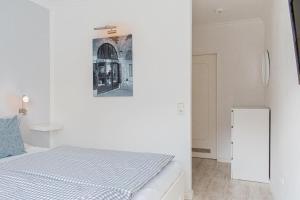 Postel nebo postele na pokoji v ubytování Ferienwohnung Strandkörbchen - Scharbeutz