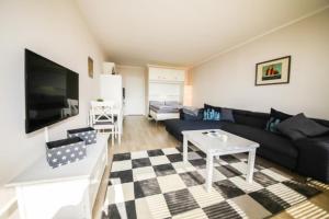 TV a/nebo společenská místnost v ubytování Ferienwohnung Residenz App. 327 + 9 fotografií
