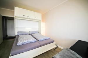 Postel nebo postele na pokoji v ubytování Ferienwohnung Residenz App. 327