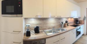Kuchnia lub aneks kuchenny w obiekcie Chalet Noriker