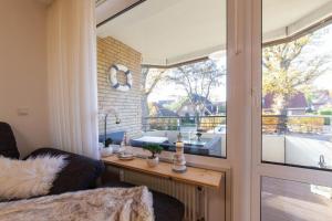 Posezení v ubytování Ferienwohnung Strandbude 11 -Timmendorfer Strand