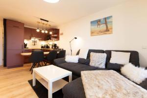 Posezení v ubytování Ferienwohnung Strandbude 11 -Timmendorfer Strand