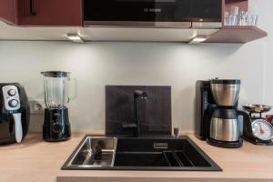 Kuchyň nebo kuchyňský kout v ubytování Ferienwohnung Strandbude 11 -Timmendorfer Strand