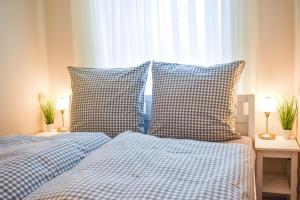 Postel nebo postele na pokoji v ubytování Ferienwohnung Strandbude 11 -Timmendorfer Strand