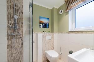 Koupelna v ubytování Ferienwohnung 4 Haus Meeresrauschen in Haffkrug + 29 fotografií